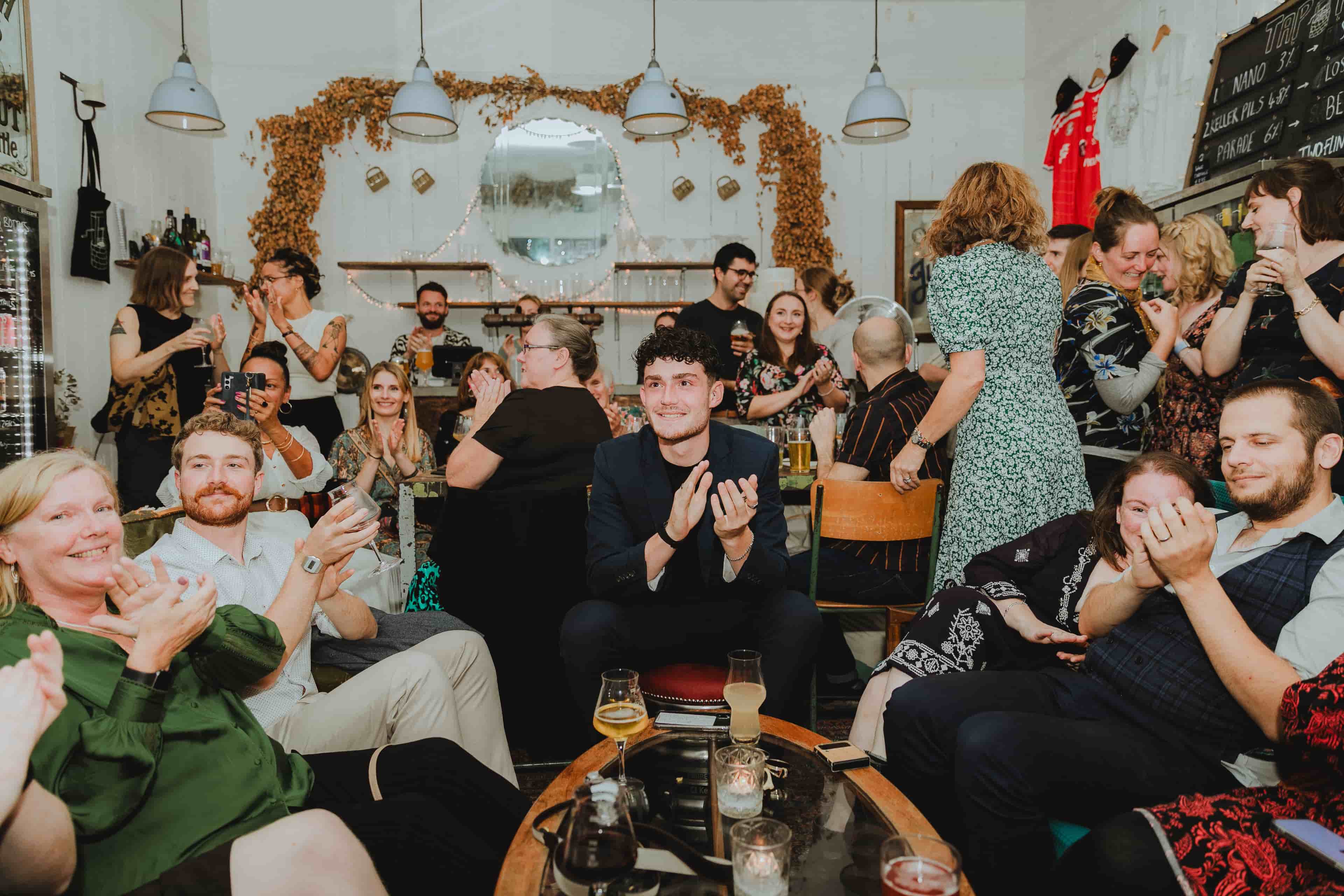 Person clapping in the kemptown pub.