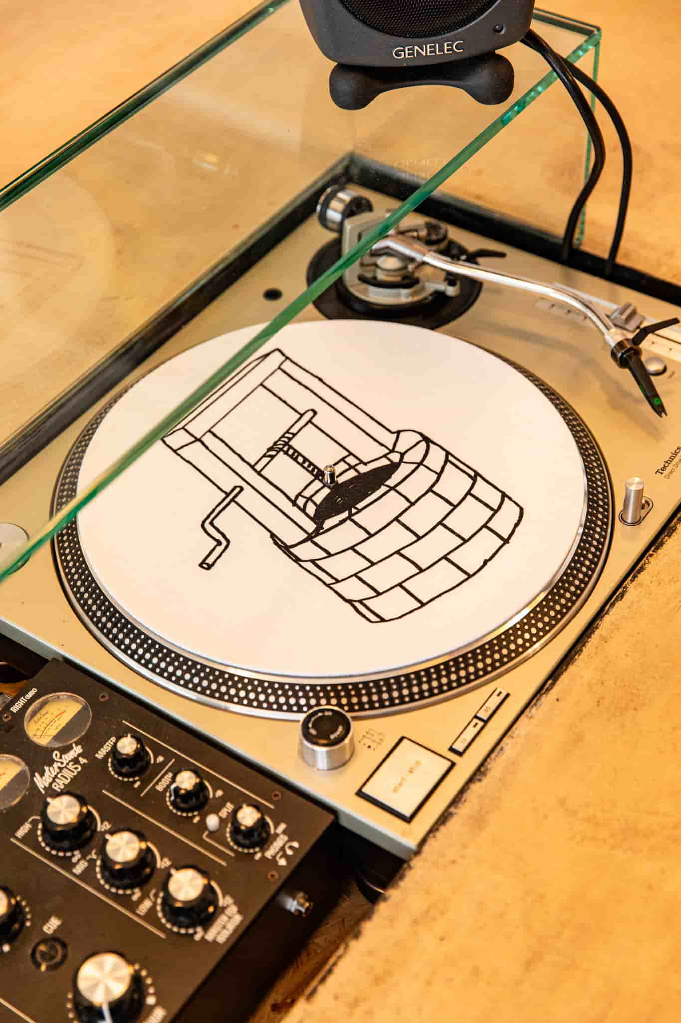 Turntable behind bar by Ellen Richardson